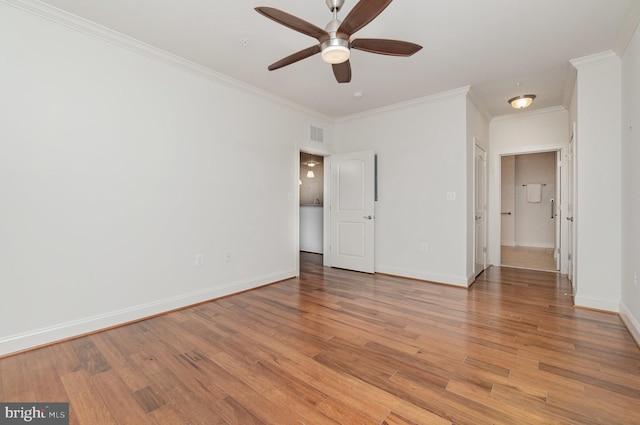 unfurnished bedroom with ceiling fan, light hardwood / wood-style floors, and crown molding