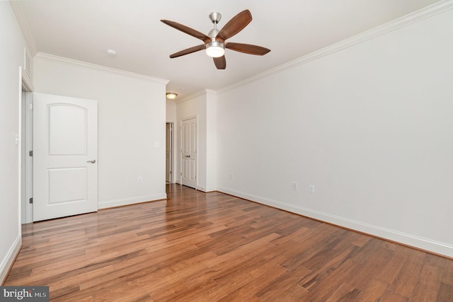 empty room with wood-type flooring, ceiling fan, and crown molding