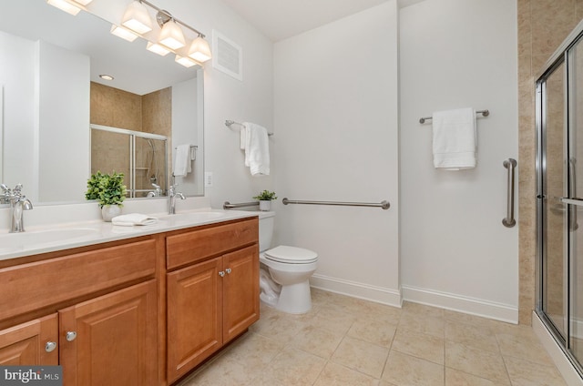 bathroom with toilet, an enclosed shower, vanity, and tile patterned floors