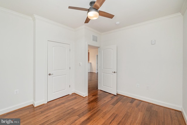 unfurnished bedroom with hardwood / wood-style flooring, ceiling fan, and crown molding