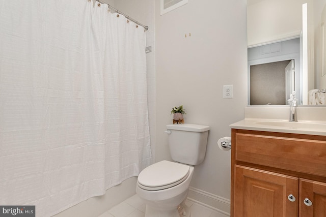 full bathroom with vanity, tile patterned floors, toilet, and shower / tub combo