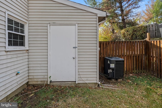 view of outbuilding featuring central air condition unit