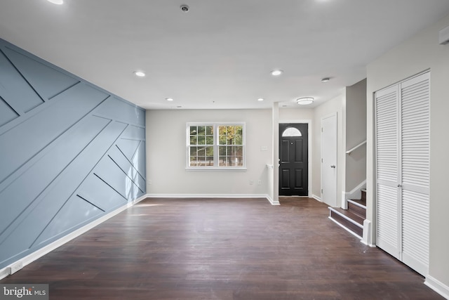 entryway with dark hardwood / wood-style floors