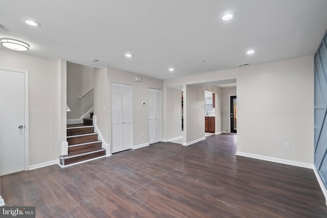 empty room with dark wood-type flooring