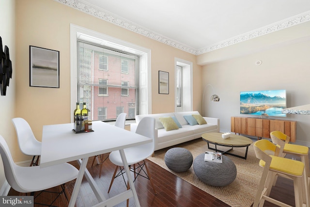 living room featuring crown molding and hardwood / wood-style flooring