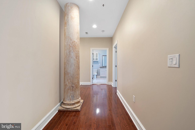 hall with dark hardwood / wood-style flooring