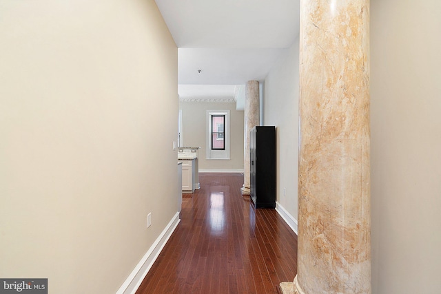 hallway with dark hardwood / wood-style floors