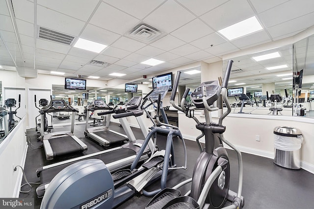 workout area featuring a drop ceiling