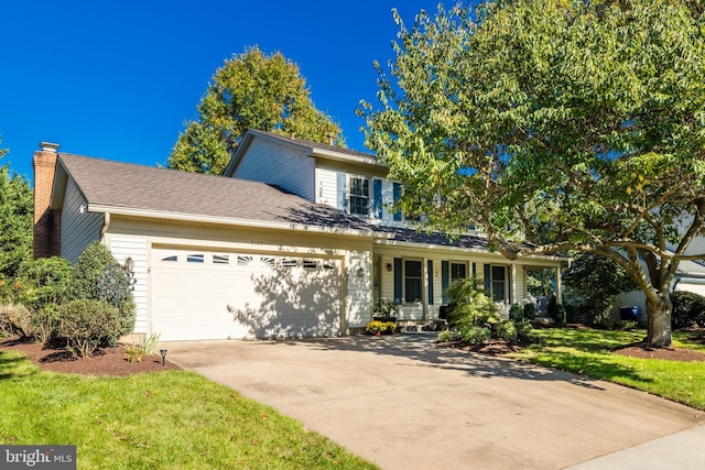 view of front facade with roof with shingles, a chimney, concrete driveway, a garage, and a front lawn