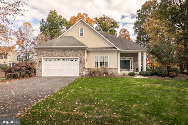 view of front facade featuring a garage and a front lawn