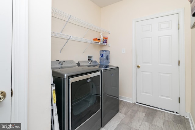 washroom featuring washer and clothes dryer