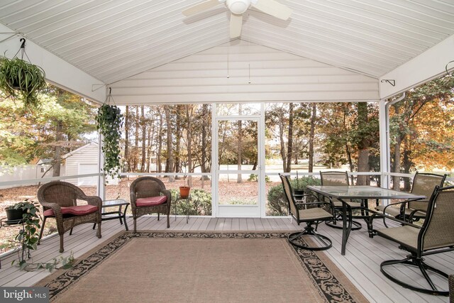 sunroom / solarium with lofted ceiling and ceiling fan