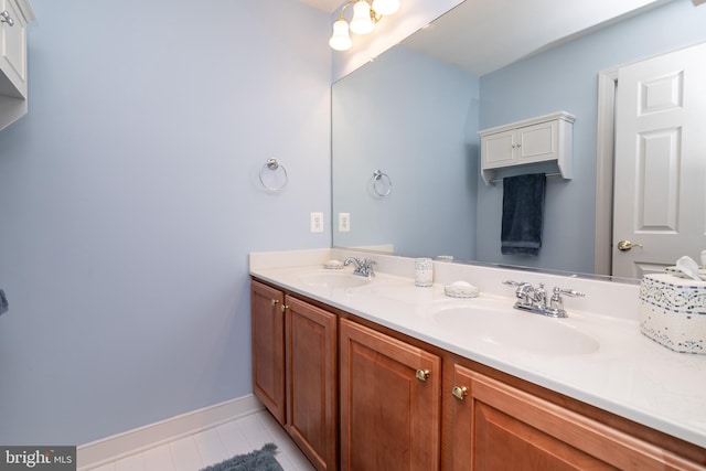 bathroom with tile patterned flooring and vanity