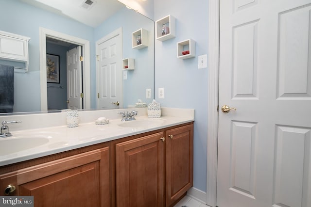 bathroom with vanity and tile patterned floors