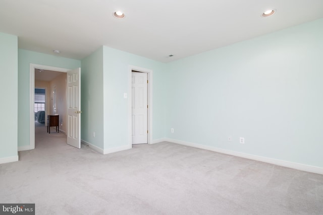 unfurnished bedroom featuring light colored carpet