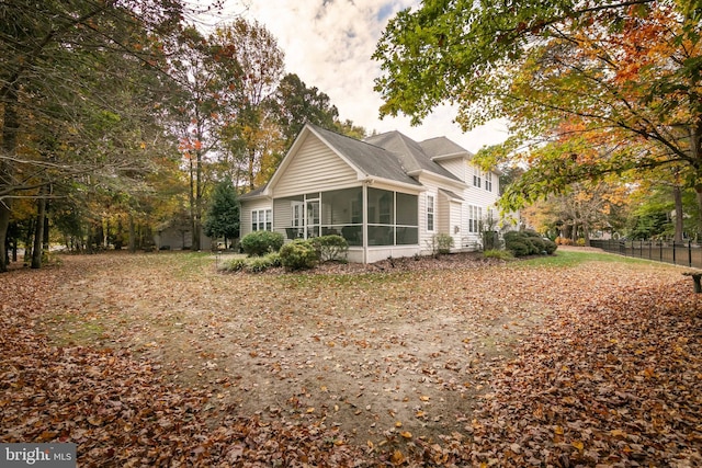 view of home's exterior featuring a sunroom