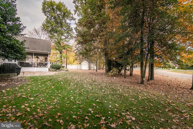 view of yard with a sunroom