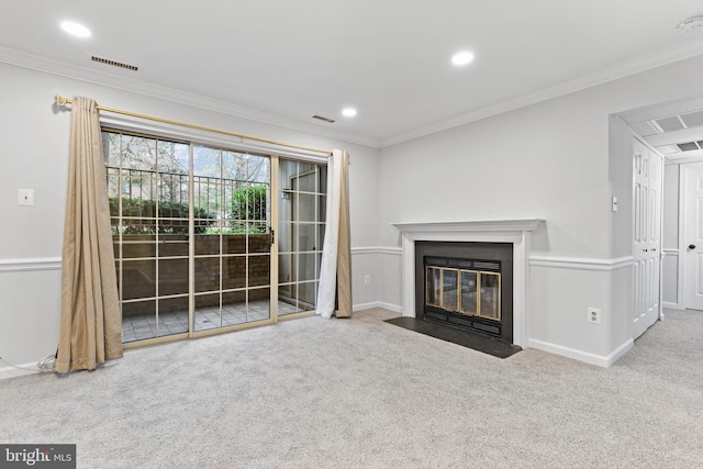 unfurnished living room with ornamental molding and carpet floors