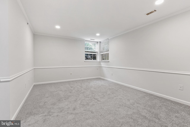 spare room with carpet floors and crown molding