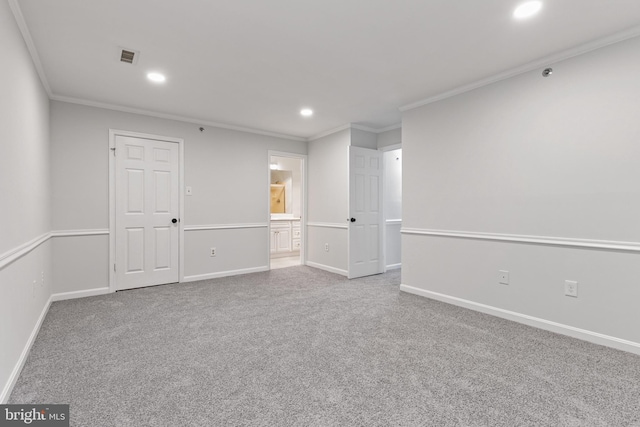 carpeted spare room with ornamental molding