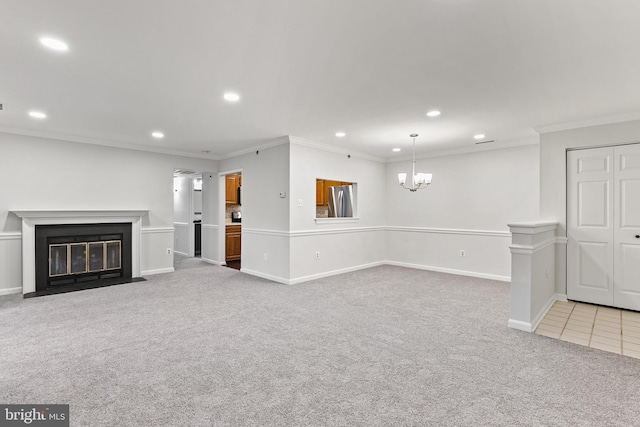 unfurnished living room with crown molding and carpet