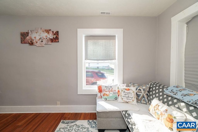 sitting room featuring hardwood / wood-style flooring