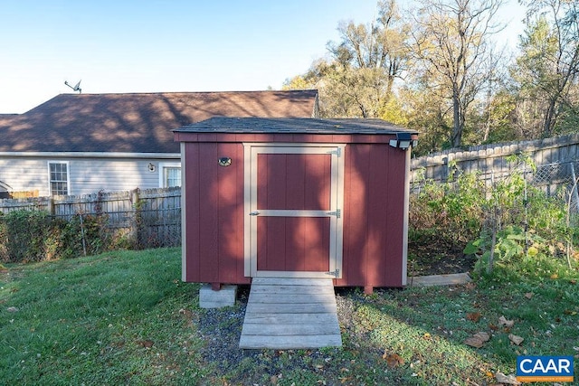 view of outdoor structure with a lawn