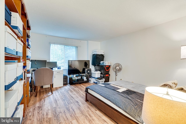 bedroom with light hardwood / wood-style flooring