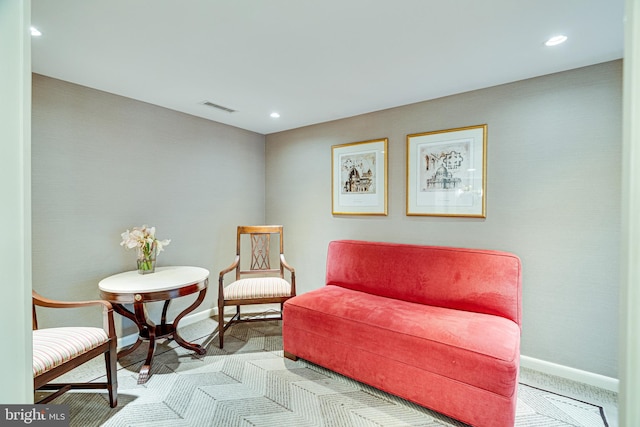 sitting room with light carpet