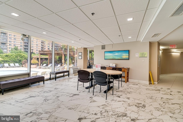 dining space featuring a paneled ceiling