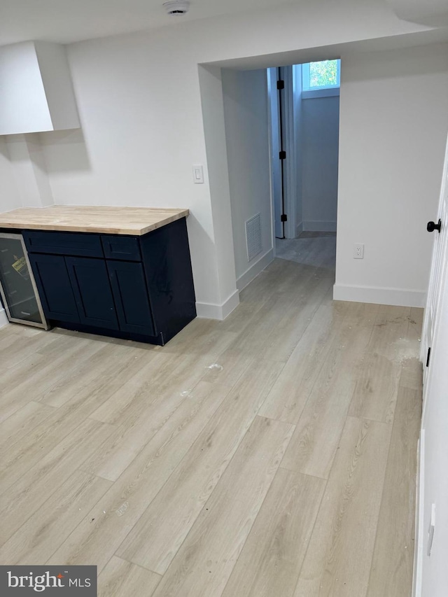 kitchen featuring light hardwood / wood-style flooring and butcher block countertops