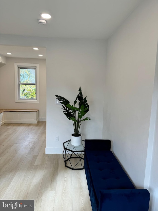 living area with hardwood / wood-style floors