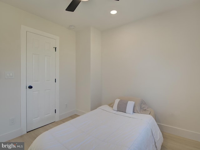 bedroom featuring light hardwood / wood-style flooring and ceiling fan