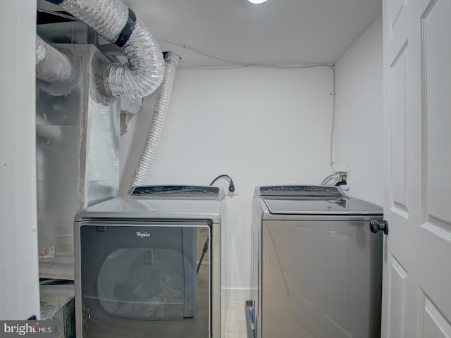 laundry area with separate washer and dryer