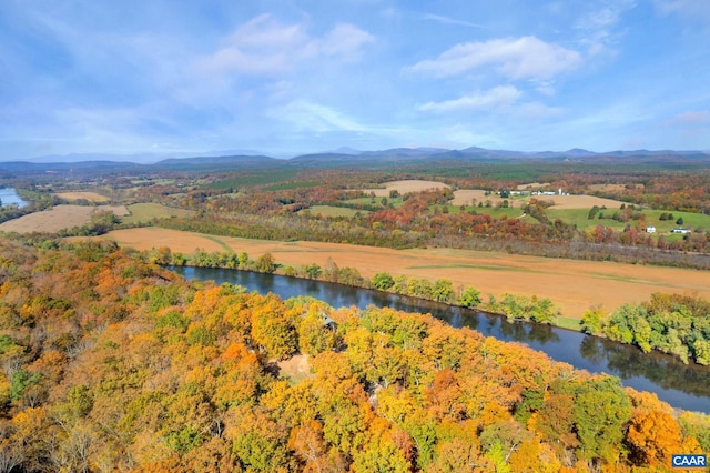 aerial view featuring a water and mountain view