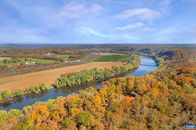 drone / aerial view featuring a water view and a rural view