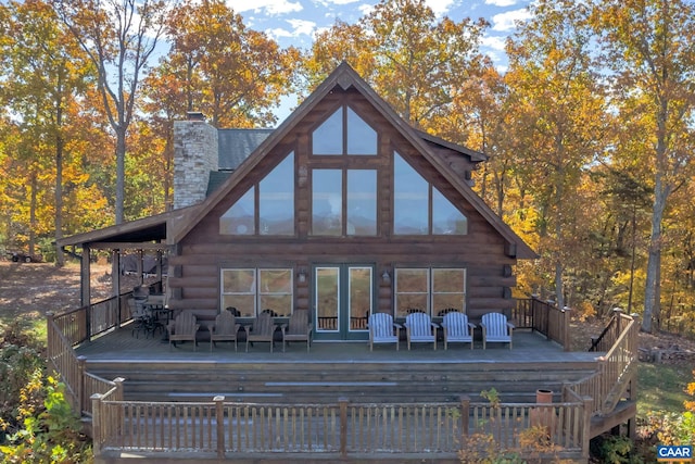 back of house featuring a deck and an outdoor hangout area