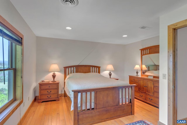 bedroom with light hardwood / wood-style flooring