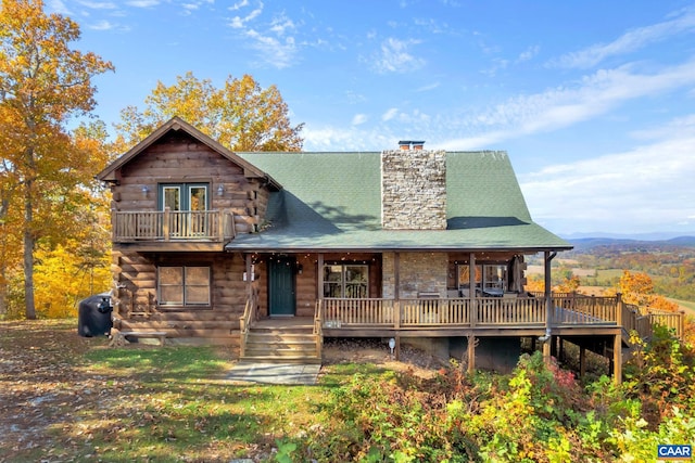 rear view of house with a wooden deck