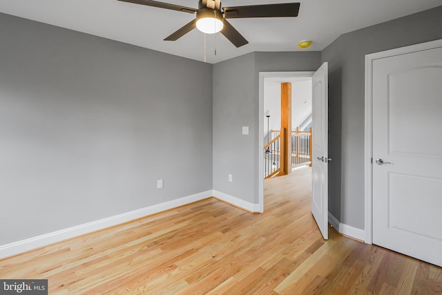 unfurnished room with ceiling fan and light hardwood / wood-style flooring