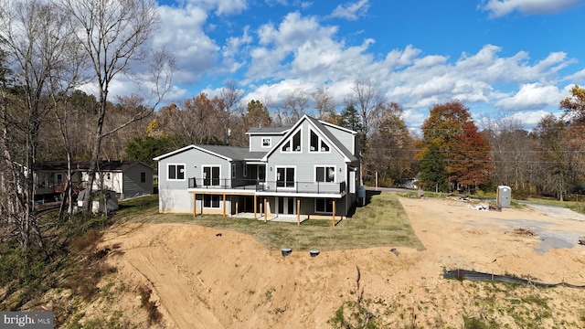 back of property with a wooden deck