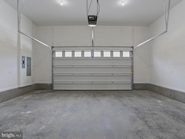 garage featuring electric panel and a garage door opener