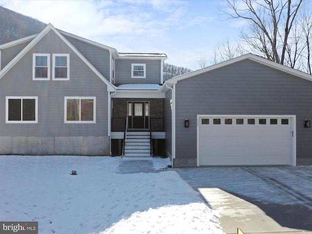 front facade featuring a garage and covered porch