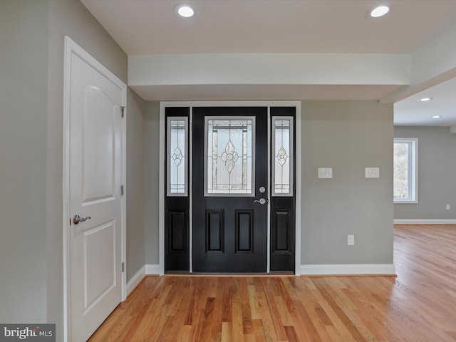 entrance foyer with light hardwood / wood-style flooring