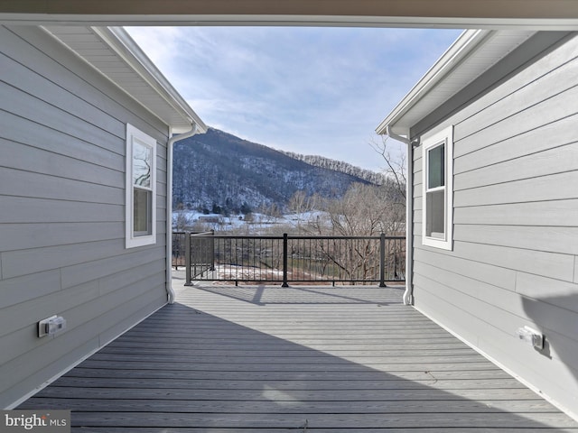 wooden terrace with a mountain view