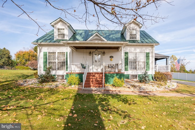 cape cod-style house with a porch and a front yard