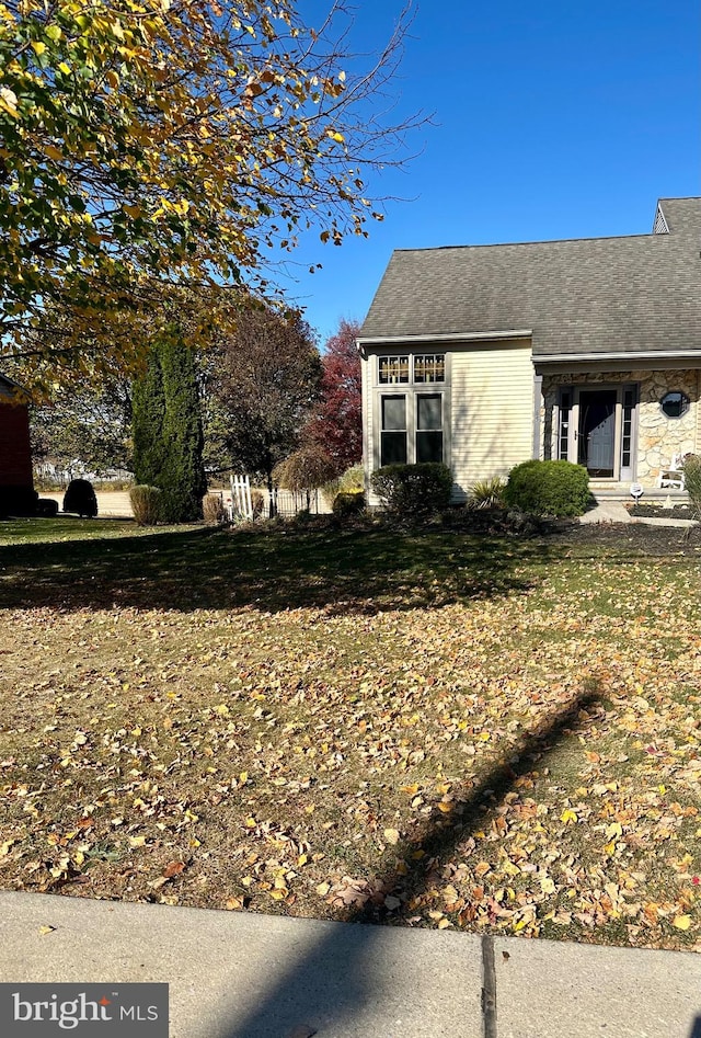 view of home's exterior featuring a lawn