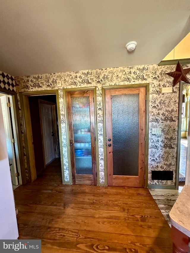 foyer with dark hardwood / wood-style flooring