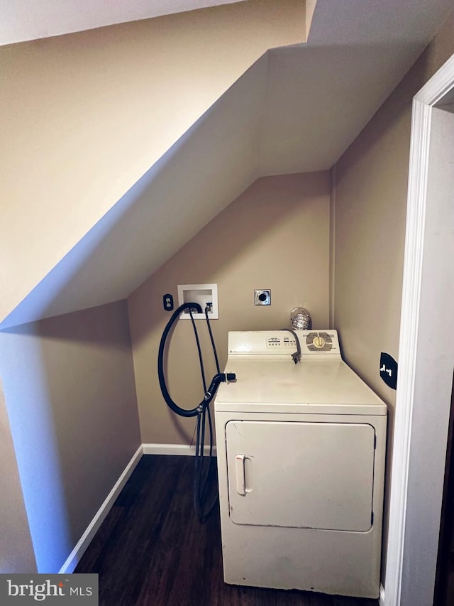 laundry area featuring dark wood-type flooring and washer / clothes dryer