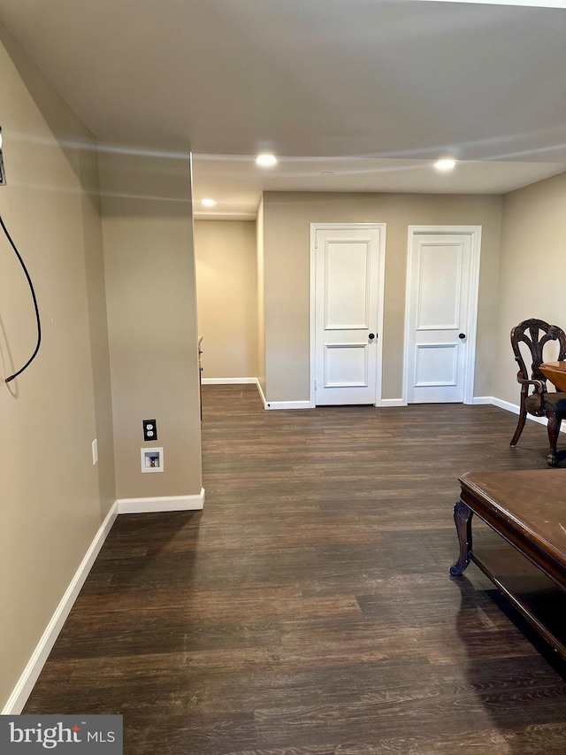 sitting room with dark hardwood / wood-style floors